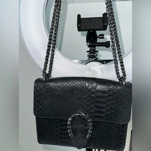 Black purse made in Italy by Vera Pelle